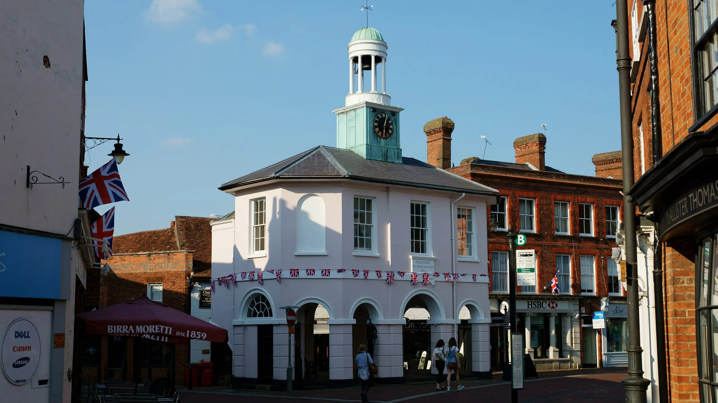 The white Pepperpot market house with its clock cupola on Godalming High Street