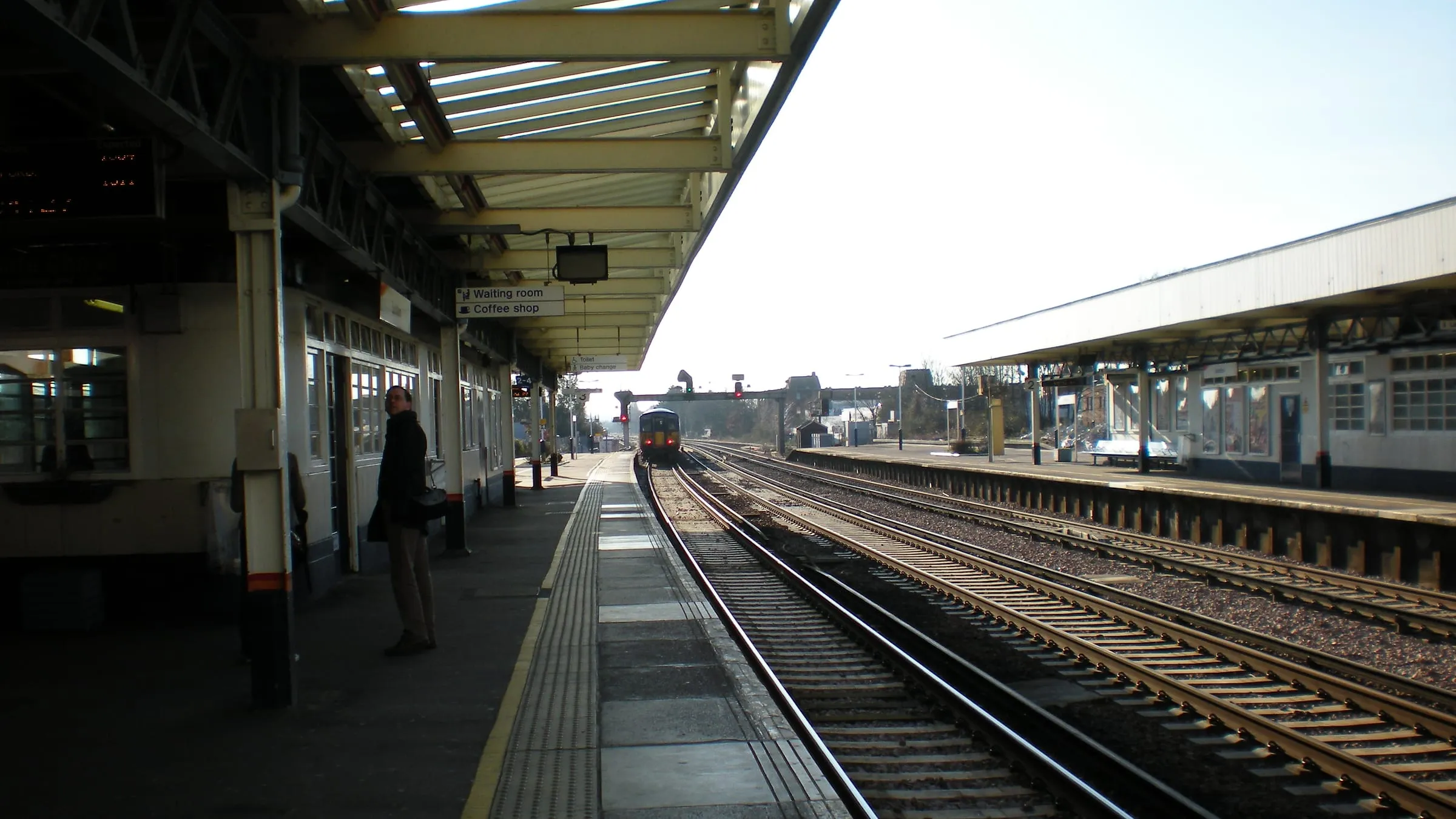 The white art deco frontage of Surbiton station, with its clock tower and tall windows