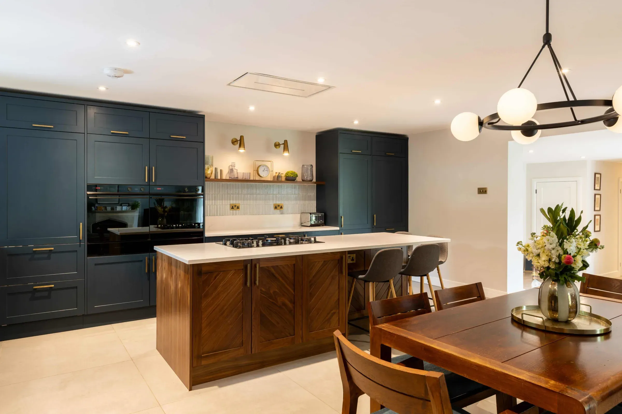 The open kitchen and dining room at the centre of a remodelled 1960s bungalow in Horsell, Woking