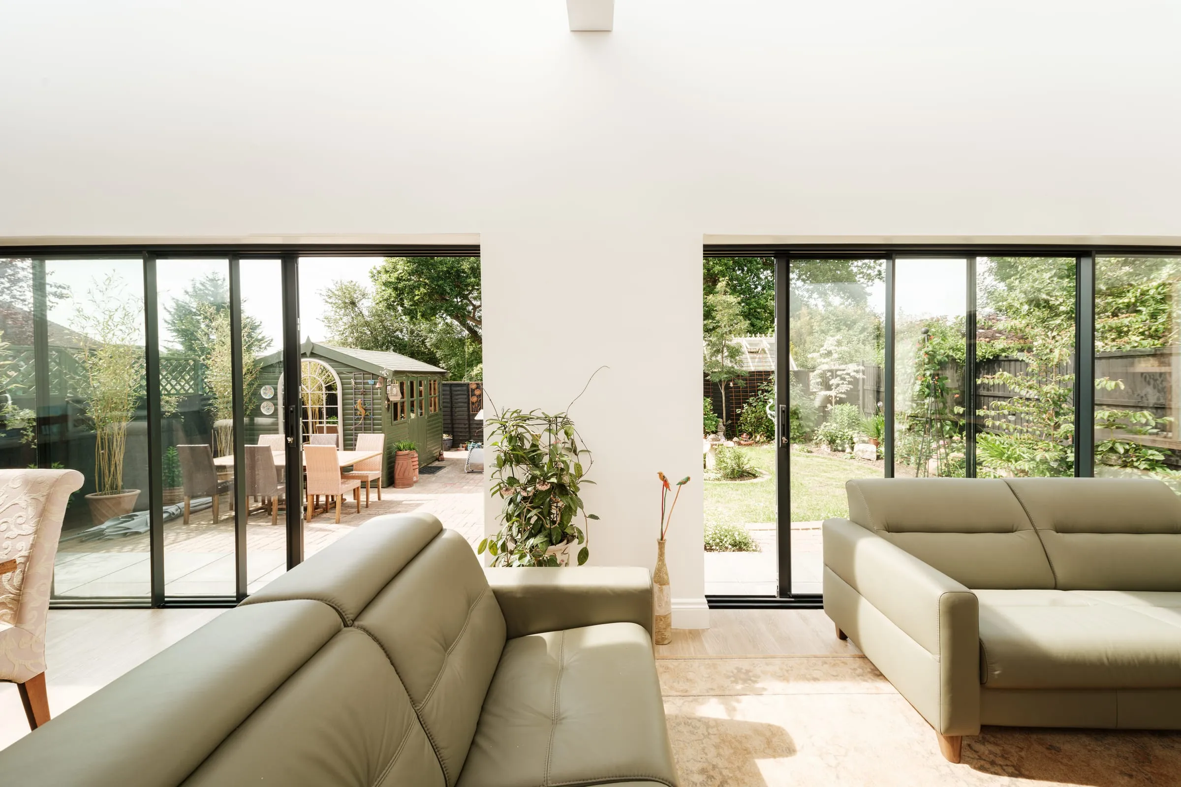 A living room in a Reading bungalow with two wide sliding doors onto the garden
