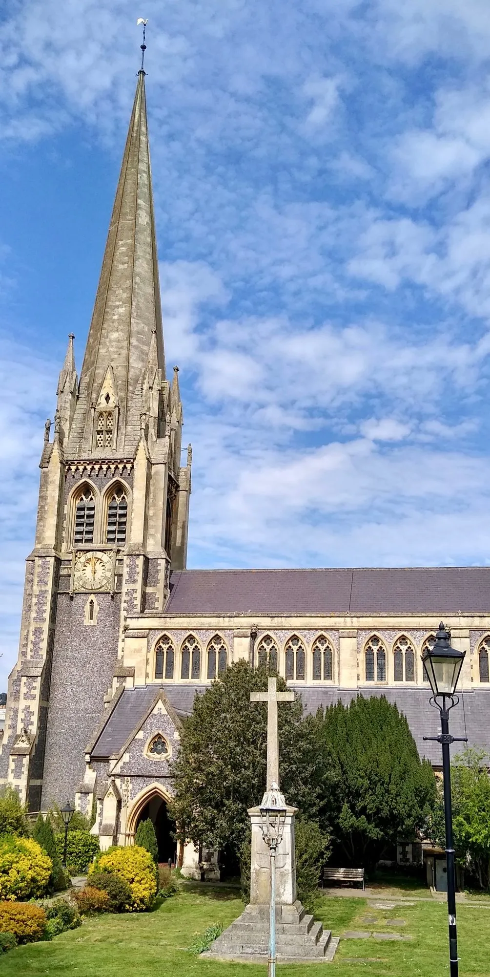 The spire of St Martin’s Church rising above the trees and churchyard in the centre of Dorking